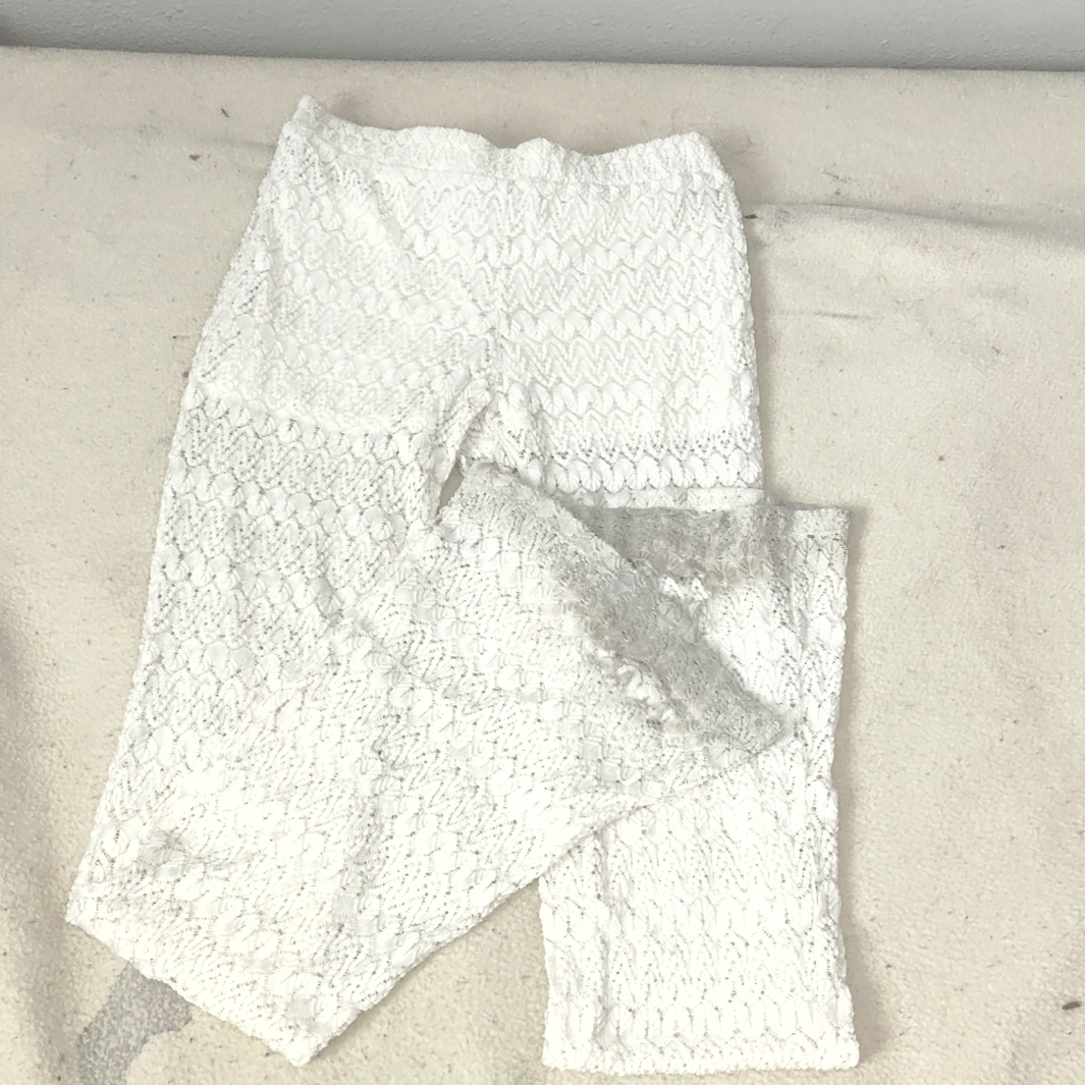 White/beige lace leggings.